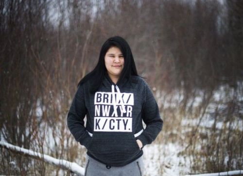 Rebecca Hookimaw, 17, poses for a photograph in the northern Ontario First Nations reserve in Attawapiskat, Ont., on Thursday, April 21, 2016. Hookimaw began drinking and taking pills and tried to commit suicide before and after the suicide of her sister Sheridan Hookimaw who was 13-years-old. THE CANADIAN PRESS/Nathan Denette